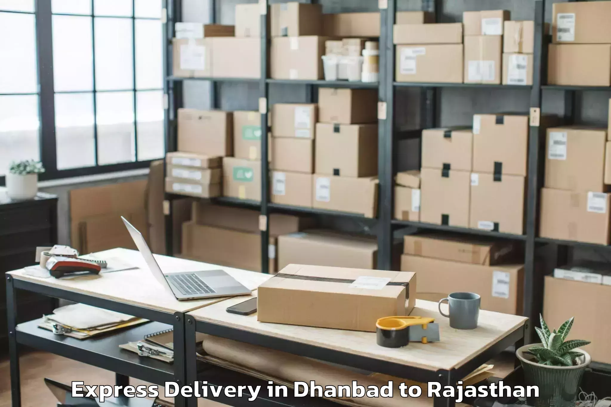 Professional Dhanbad to Raj Rishi Bharthari Matsya Uni Express Delivery